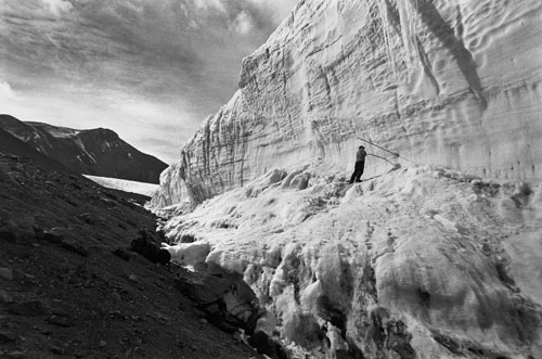 <p>Paul Langevin drills into the Canada Glacier near Lake Hoare.</p><p>&ldquo;These glaciers are important in the Taylor Valley. We look at the streams flowing from the glaciers and the change of mass of the glacier. When I first came there was a sense of surrealness of the place. All the normal elements I knew like mountains, sun, and glaciers were here. But it&rsquo;s different, it&rsquo;s untouched by water so you have features that have been here for hundreds of thousands of years that normally wouldn&rsquo;t survive. And because there is no vegetation, there is no scale: you don&rsquo;t know how far away things are.&rdquo;<br/>—Paul Langevin</p>