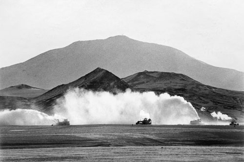 From the rim, the scientists get a good look at the lava lake below. Some even rappel far down the steep slope.